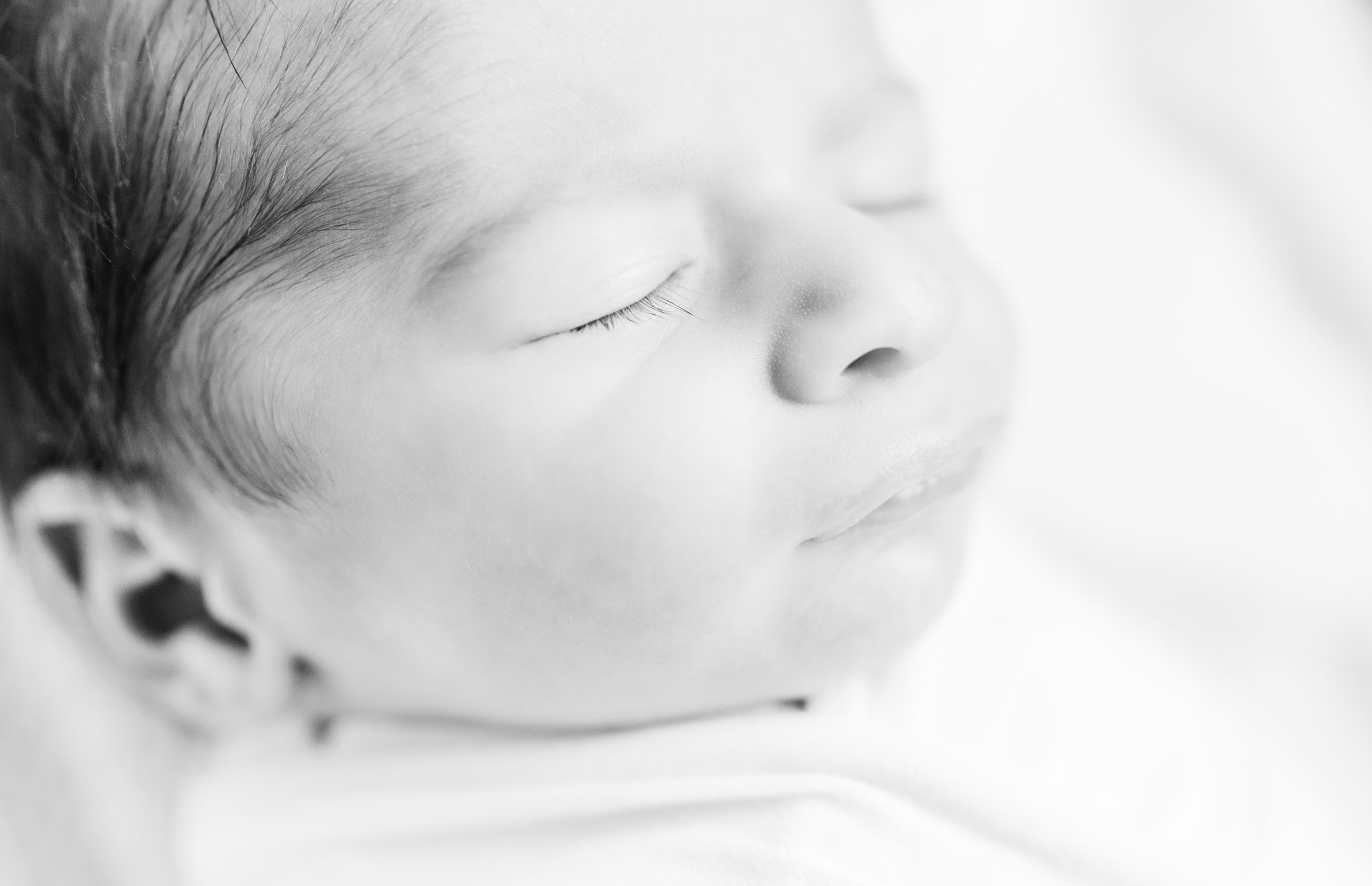 Black and white close up of baby eyelashes by Northern Virginia Newborn Photographer