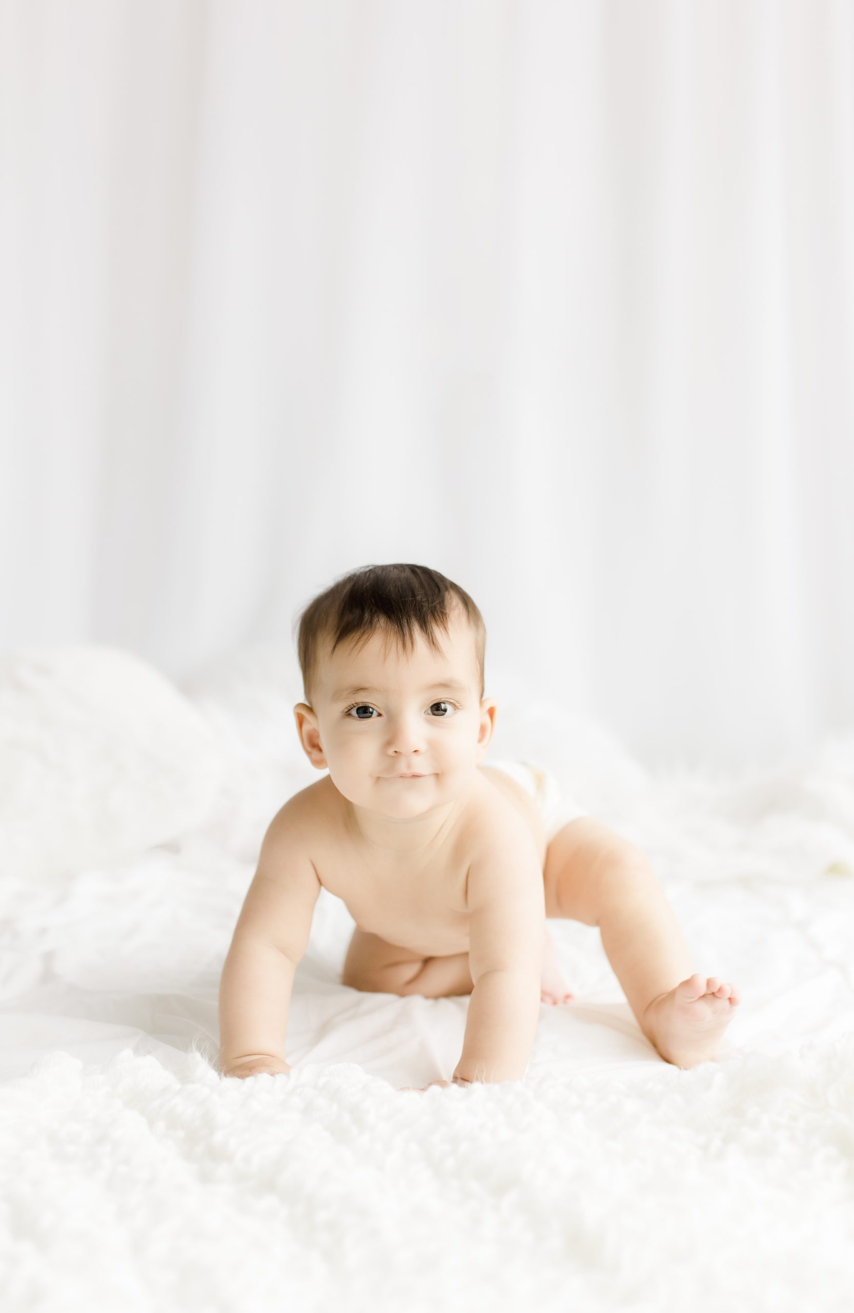 Baby crawling toward camera by Northern Virginia Baby Photographer