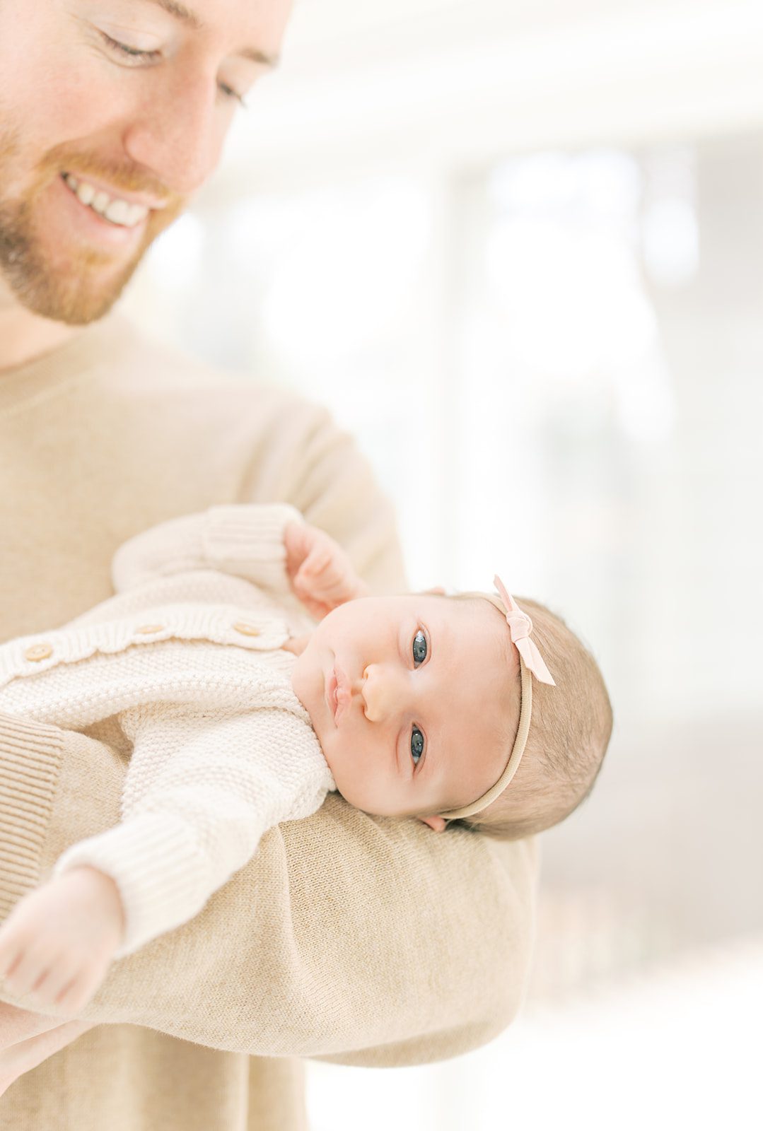 baby girl making eye contact by DC Newborn Photographer