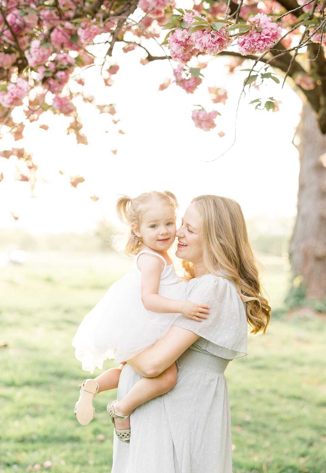 mom and daughter under the kwanzan cherry trees