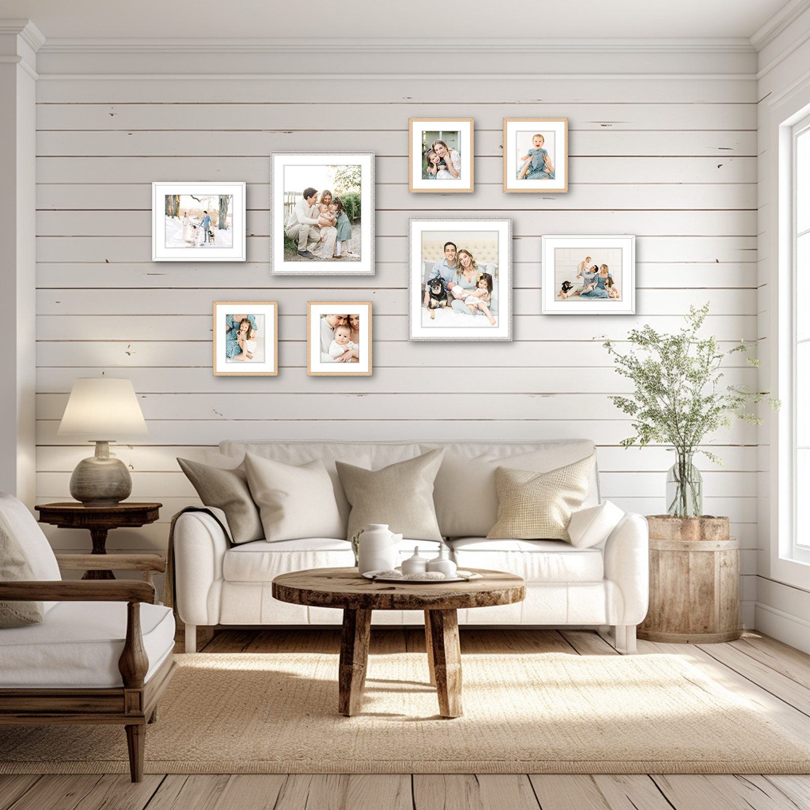 Framed family and newborn portraits hang on a living room wall captured by a baby photographer in DC